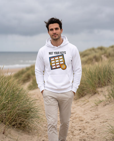 Not Your Keys on a white hoodie, coastal path