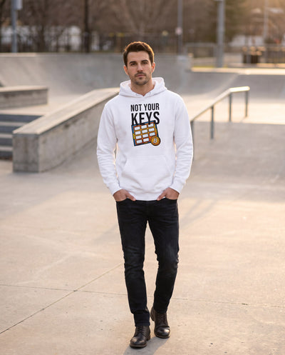Not Your Keys on a white hoodie, concrete plaza